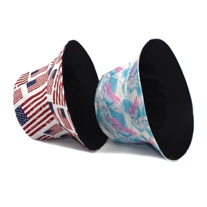 Reversible bucket hat with American flag print and abstract graffiti pattern for sun protection