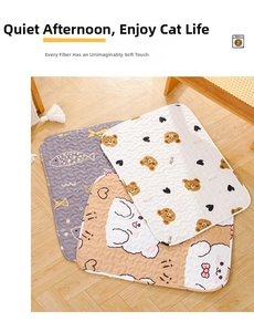 Detail of soft quilted pet mats with bear and cat patterns on wooden flooring