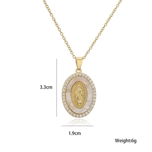Detailed view of 18K gold Virgin Mary pendant with mother of pearl and zircon inlay