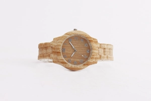 Close-up of a fashionable ladies' watch featuring natural wood grain texture and round dial