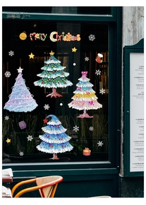 Détail de stickers de Noël colorés avec texture de peinture à l'huile pour vitres et fenêtres