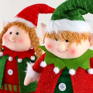 Charming red and green Christmas elf dolls set for holiday desktop decoration and display