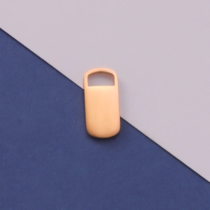 Macro detail of rectangle rose gold stainless steel pendant tag for DIY jewelry