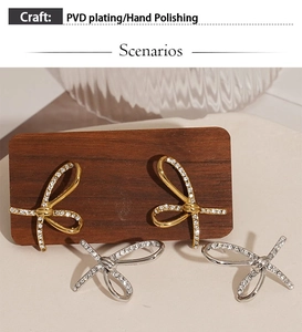 Detail of PVD plated bow earrings in gold and silver with cubic zirconia inlay