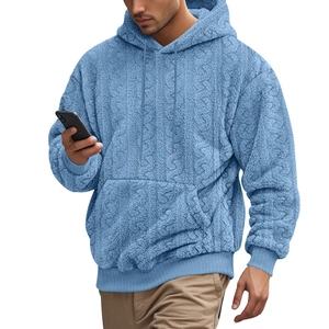 Close-up of blue teddy fleece fabric texture on men's hooded sweatshirt with drawstring