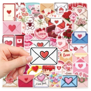 Hand holding heart envelope sticker from a 50-piece romantic love themed decoration set