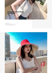 Detail of red oversized brim sun hat with adjustable beige chin strap for women