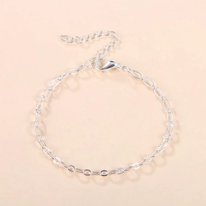 Polished silver metal chain bracelet with oval links and adjustable lobster clasp closure