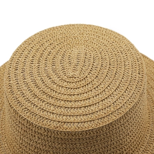 Detailed macro shot of the tight spiral weave and flat crown on a natural straw beach hat