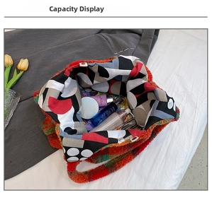 Interior view showing the large capacity of the plaid fleece tote bag with cosmetics