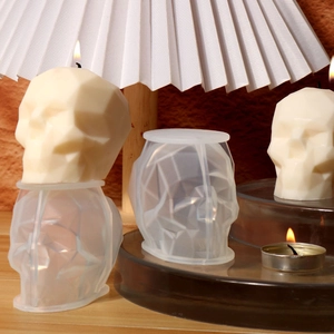 Detailed geometric faceted skull candle mold with finished 3D silicone skull candle crafts
