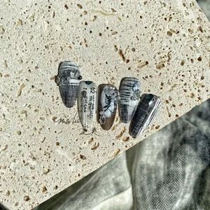 Nail art stickers with grey plaid pattern, Chinese calligraphy, and 3D pearl accents