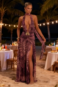 Detail of deep V-neck dress with animal print and gold flower waist decoration