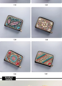 Detail of bohemian handmade beaded coin purses with ethnic embroidery and zipper closure