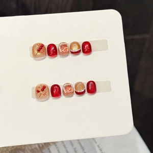 Uñas postizas festivas rojas y doradas con efecto ojo de gato y diseño chino