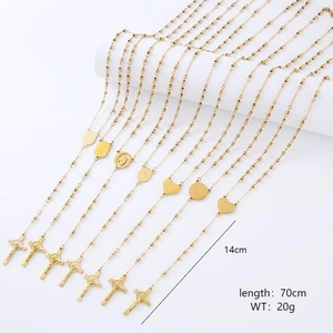 Detail view of golden rosary necklaces with crucifix pendants and 70cm chain measurements