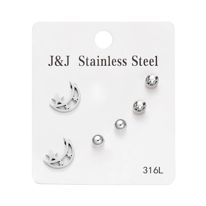 Detail of 316L stainless steel earring set with moon, crystal, and ball stud designs