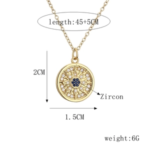 Detail of gold heart devil eye necklace with measurements 1.5x2cm and 45+5cm chain
