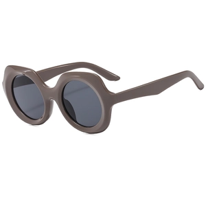 Retro polygon oversized sunglasses in taupe with wavy frame and dark UV protective lenses