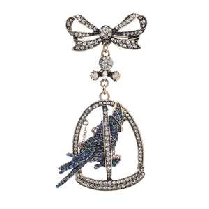 Vintage bronze parrot birdcage brooch with crystal bow and teal rhinestones