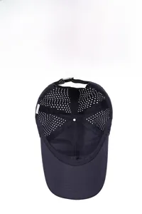 Detail view of laser-cut ventilation holes on navy blue breathable outdoor baseball cap