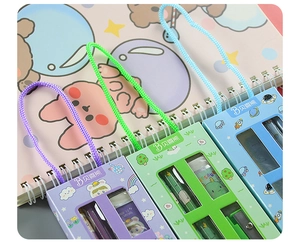 Detail of cartoon stationery sets in purple, green and blue with gift box packaging