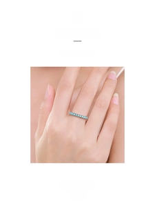 Detail view of a S925 sterling silver ring featuring an elegant row of blue turquoise stones