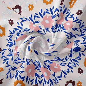 Close-up of floral tapestry fabric texture showing soft pleats and colorful patterns