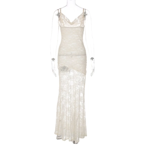 Detailed close-up of cream lace maxi dress featuring sheer fabric and delicate floral texture