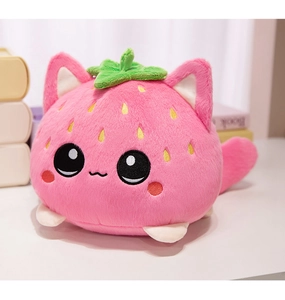 Close-up of pink strawberry cat plush toy with soft texture and embroidered seeds