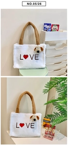 Detail of white plush tote bag with brown Love embroidery and cute puppy charm accessory