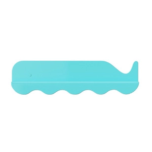 Detail of the whale-shaped cyan silicone baby bath brush with soft bristles and ergonomic grip