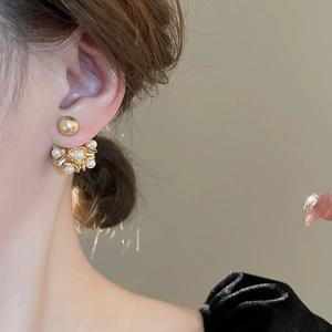 Vintage French style faux pearl flower earrings in matte gold finish worn by model