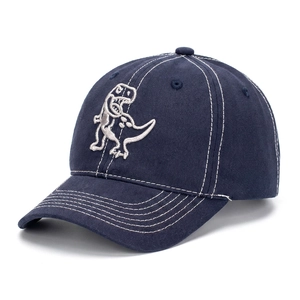 Detailed view of kids' navy cotton baseball cap with dinosaur embroidery