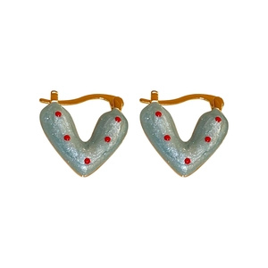 Polished gold heart hoop earrings with blue pearlescent coating and red polka dots
