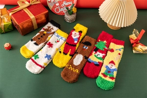 Fuzzy Christmas socks in coral fleece featuring Santa and reindeer embroidery in a gift box
