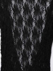 Close-up detail of intricate floral lace texture on a black floor-length sexy dress