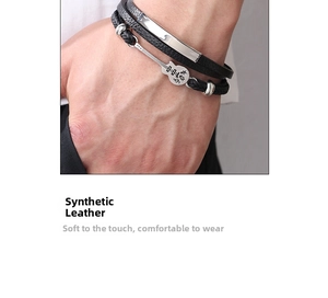 Detail view of men's multilayer leather bracelet with silver guitar charm and metal plate