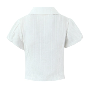 Close-up of the back of a white short-sleeve shirt with puff sleeves and textured fabric