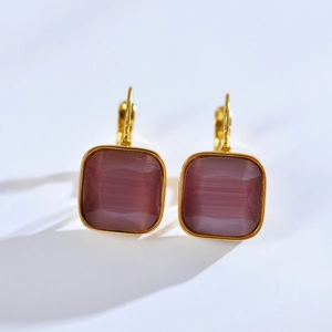 Gold stainless steel hoop earrings with cushion-cut purple gemstones and secure clasps
