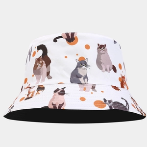 Close-up of the cartoon cat illustrations and fabric texture on white bucket hat