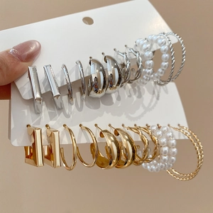 Assorted set of gold and silver geometric earrings with pearls on display card
