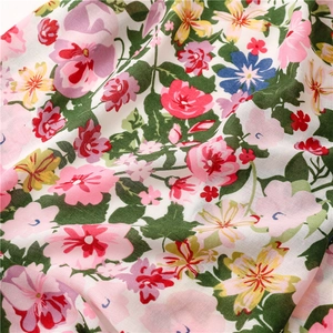Lightweight cotton linen floral scarf with tassels featuring vibrant pink and blue flowers