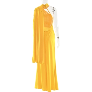 Detail of yellow backless halter dress with long draping fabric in smooth satin finish