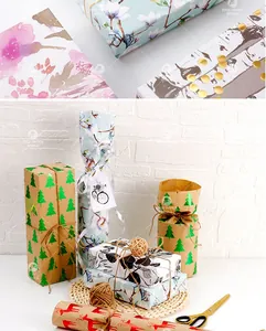 Detail of floral and vintage leaf wrapping paper with gold foil accents and jute rope