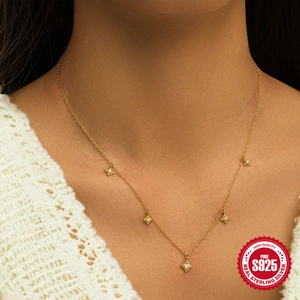 Elegant gold S925 sterling silver necklace featuring five star pendants with clear zircons