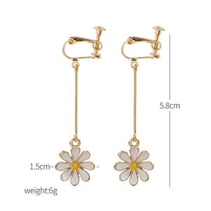 Detail view of daisy drop clip earrings showing 5.8cm length and gold-plated stems