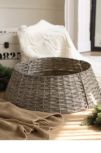 Detail of round hand-woven brown Christmas tree basket base with sturdy metal frame