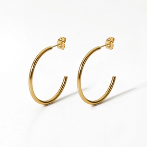 Minimalist 18K gold plated stainless steel C-shaped hoop earrings on white background