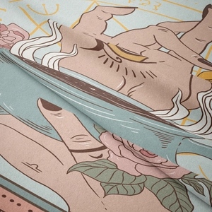 Close-up of bohemian tarot tapestry showing mystic hand symbols and woven fabric texture